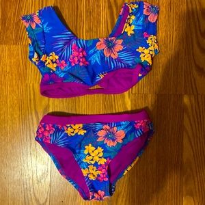 A neon SO brand girl’s swimsuit, with floral design. Size 10.